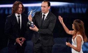 Colombian executive and chairman of Atletico Nacional Juan Carlos de la Cuesta (C) holds The 2016 FIFA Fair Play Award next to former Spanish football player Carles Puyol and co-host and US actress Eva Longoria during The Best FIFA Football Awards ceremony, on January 9, 2017 in Zurich. / AFP PHOTO / Fabrice COFFRINIFABRICE COFFRINI/AFP/Getty Images