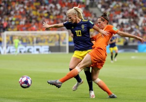 LYON, FRANCE - JULY 03: Sofia Jakobsson of Sweden is challenged by Merel Van Dongen of the Netherlands during the 2019 FIFA Women's World Cup France Semi Final match between Netherlands and Sweden at Stade de Lyon on July 03, 2019 in Lyon, France. (Photo by Maja Hitij/Getty Images)